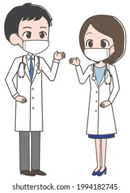 Male and female doctors wearing masks.
