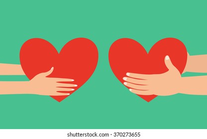 Male and female hands holding red heart giving to each other