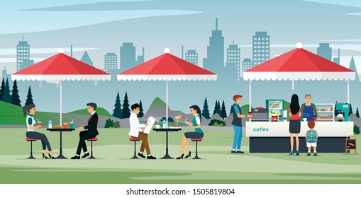 Male and female workers eating at an outdoor cafe