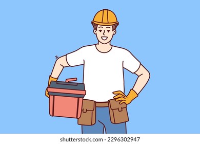Male foreman holds case of working tools for furniture repair or plumbing work and looks at screen with smile. Guy in helmet of builder works as foreman or builder providing professional services