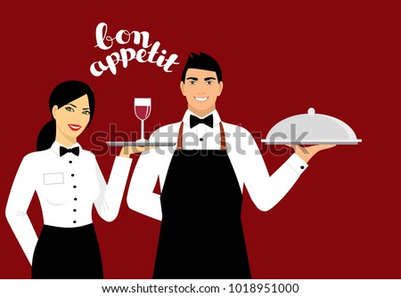 The male and the girl in the uniform of the waiter. Waitress with wine on a tray. Waiter with a tray in his hand. 