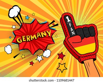 Male hand in the country flag glove of a sports fan raised up celebrating win and Germany speech bubble with stars and clouds. Vector colorful illustration in retro comic style on white background
