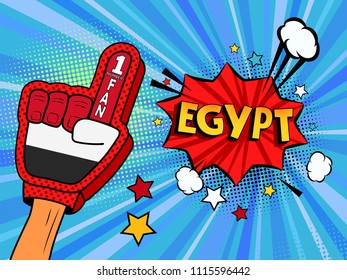 Male hand in the country flag glove of a sports fan raised up celebrating win and Egypt speech bubble with stars and clouds. Colorful illustration in retro comic style  on blue cartoon background