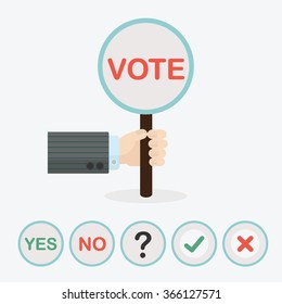 Male hand holding circle vertical paddle stick and word VOTE - with extra question mark, check mark, cross mark, word YES, and word NO icons