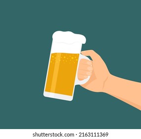 Male hand holding a glass of frothy beer on a blue and green background