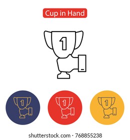 Male hand holding winner cup icon. Trophy Cup icon. Outline pictogram for web site design and mobile apps. Vector illustration. Editable stroke.