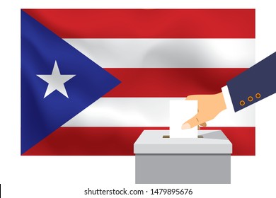 Male hand puts down a white sheet of paper with a mark as a symbol of a ballot paper against the background of the Puerto Rico flag. Puerto Rico the symbol of elections.
