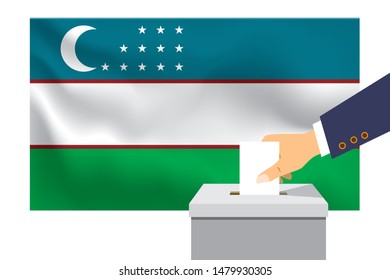 Male hand puts down a white sheet of paper with a mark as a symbol of a ballot paper against the background of the Uzbekistan flag. Uzbekistan the symbol of elections.