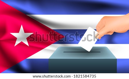 Male hand puts down a white sheet of paper with a mark as a symbol of a ballot paper against the background of the Cuba flag. Cuba the symbol of elections