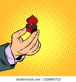 male hand with ring box, engagement. Pop art retro vector illustration kitsch vintage