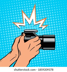 Male hands with a camera. Click and flash. The work of a photographer and a reporter. Vector colorful illustration in pop art style.