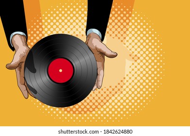 Male hands gently hold a retro vinyl record with a red label in the center - Shutterstock ID 1842624880