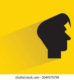 male head silhouette with shadown on yellow background