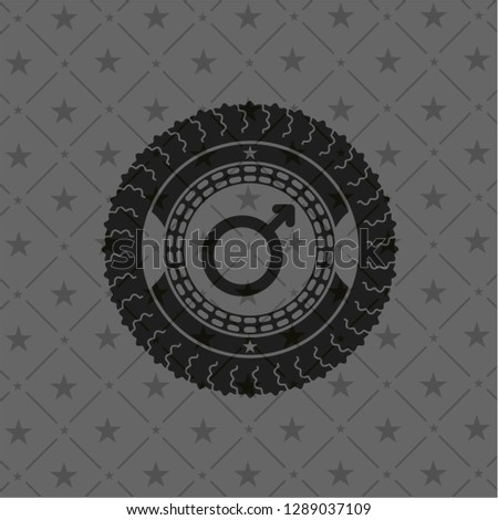 male icon inside dark emblem