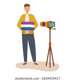 Masculino influenciencer está gravando um vídeo blog sobre roupas para seus seguidores usando uma câmera