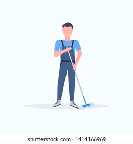 male janitor in uniform mopping floor man cleaner holding mop cleaning service concept full length flat white background