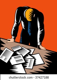 Male office worker hunched over piles of paperwork