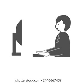 A male office worker smiling in front of the PC
