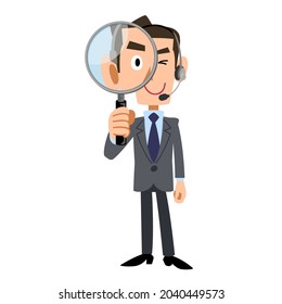 Male operator wearing a headset looking through a magnifying glass