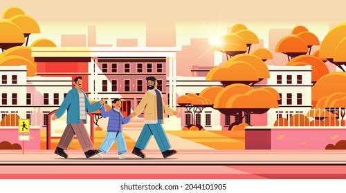 male parents walking with little son gay family transgender love LGBT community concept