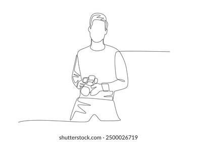 Male photographer is preparing to take a photo. World photography day concept one-line drawing