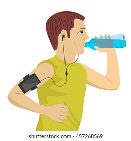 male runner listening to music on smartphone drinking water