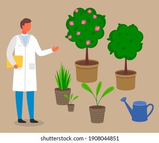 Male scientist, botanist studies and analyzes the plant. Cultivation and processing of plant. Laboratory worker man in a scientist uniform studying different vegetation rules for care and watering