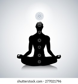 Male Silhouette In Yoga Pose With Abstract Chakra Symbols