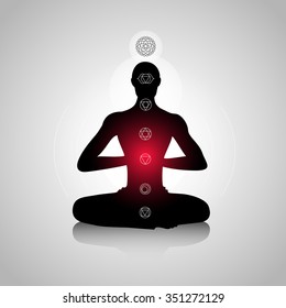 Male silhouette in yoga pose with abstract chakra symbols