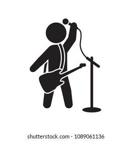 Male singer with guitar icon. Vector icon.