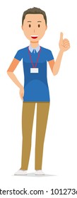 A male staff wearing a nameplate showing thumbs up