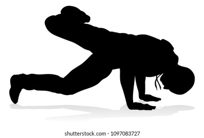 A male street dance hip hop dancer in silhouette