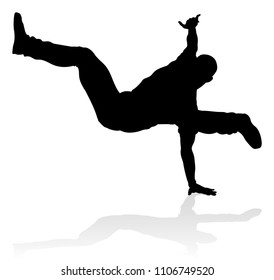 A male street dance hip hop dancer in silhouette