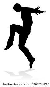 A male street dance hip hop dancer in silhouette