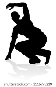 A male street dance hip hop dancer in silhouette