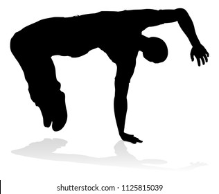 A male street dance hip hop dancer in silhouette