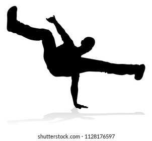 A male street dance hip hop dancer in silhouette