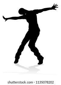 A male street dance hip hop dancer in silhouette