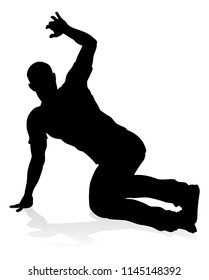 A male street dance hip hop dancer in silhouette