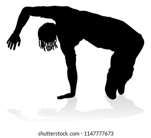 A male street dance hip hop dancer in silhouette