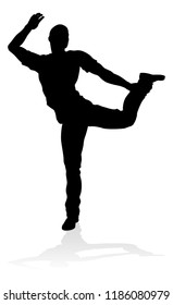 A male street dance hip hop dancer in silhouette