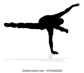 A male street dance hip hop dancer in silhouette