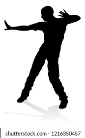 A male street dance hip hop dancer in silhouette