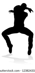 A male street dance hip hop dancer in silhouette