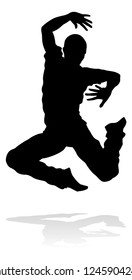 A male street dance hip hop dancer in silhouette