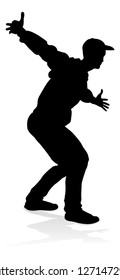 A male street dance hip hop dancer in silhouette