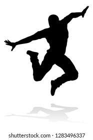 A male street dance hip hop dancer in silhouette