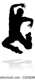 A male street dance hip hop dancer in silhouette