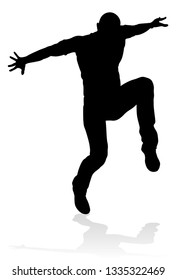 A male street dance hip hop dancer in silhouette
