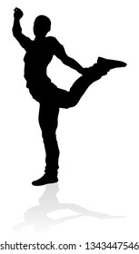 A male street dance hip hop dancer in silhouette